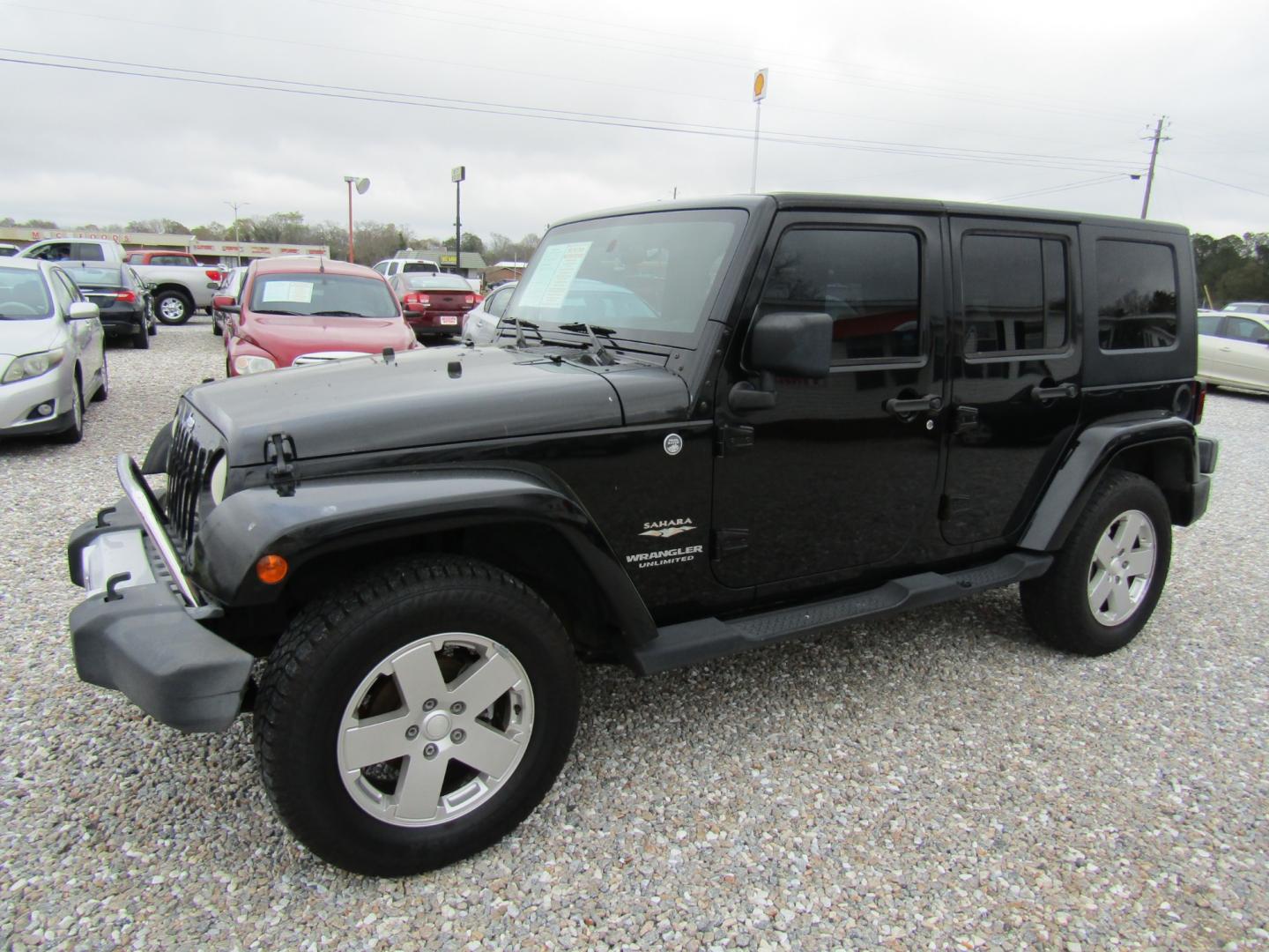 2008 Black Jeep Wrangler Unlimited Sahara 4WD (1J4GA591X8L) with an 3.8L V6 OHV 12V engine, Automatic transmission, located at 15016 S Hwy 231, Midland City, AL, 36350, (334) 983-3001, 31.306210, -85.495277 - Photo#2